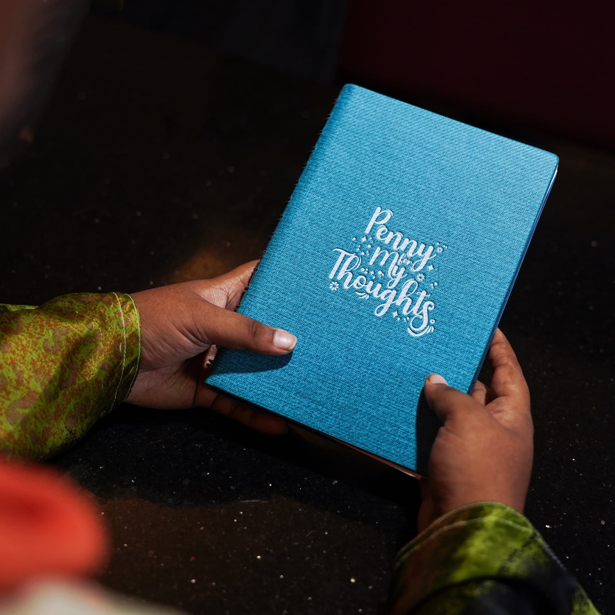 A reader holding the InkSane journal
